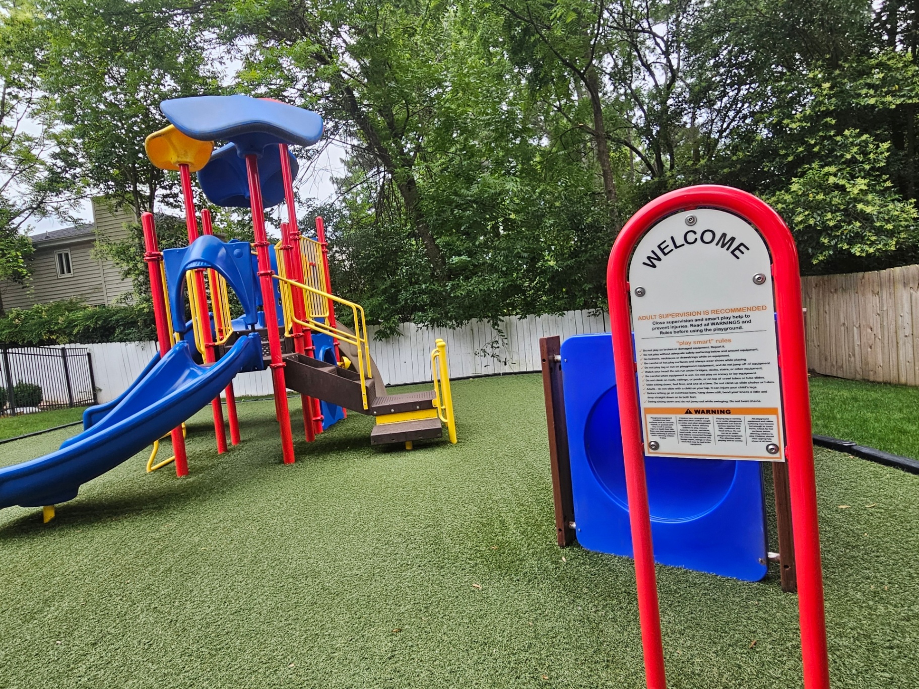 Playground welcome sign at Justice Kids Academy
