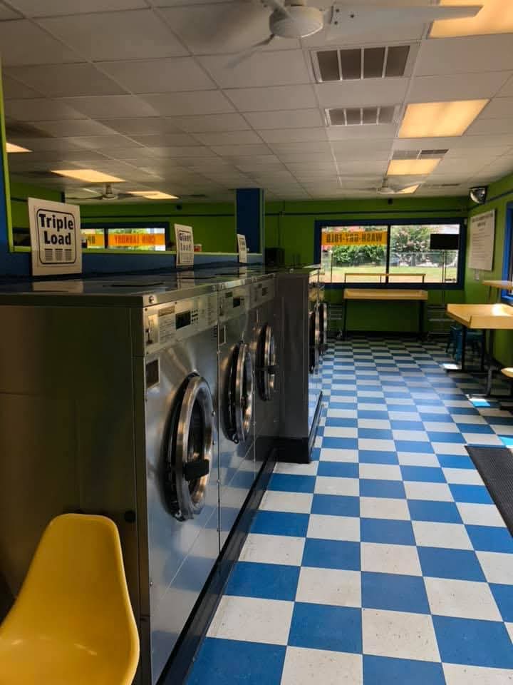 Inside Keep It Kleen Laundromat with clean washers and blue and white tile flooring